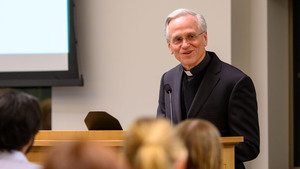 Fr. Jenkins at podium